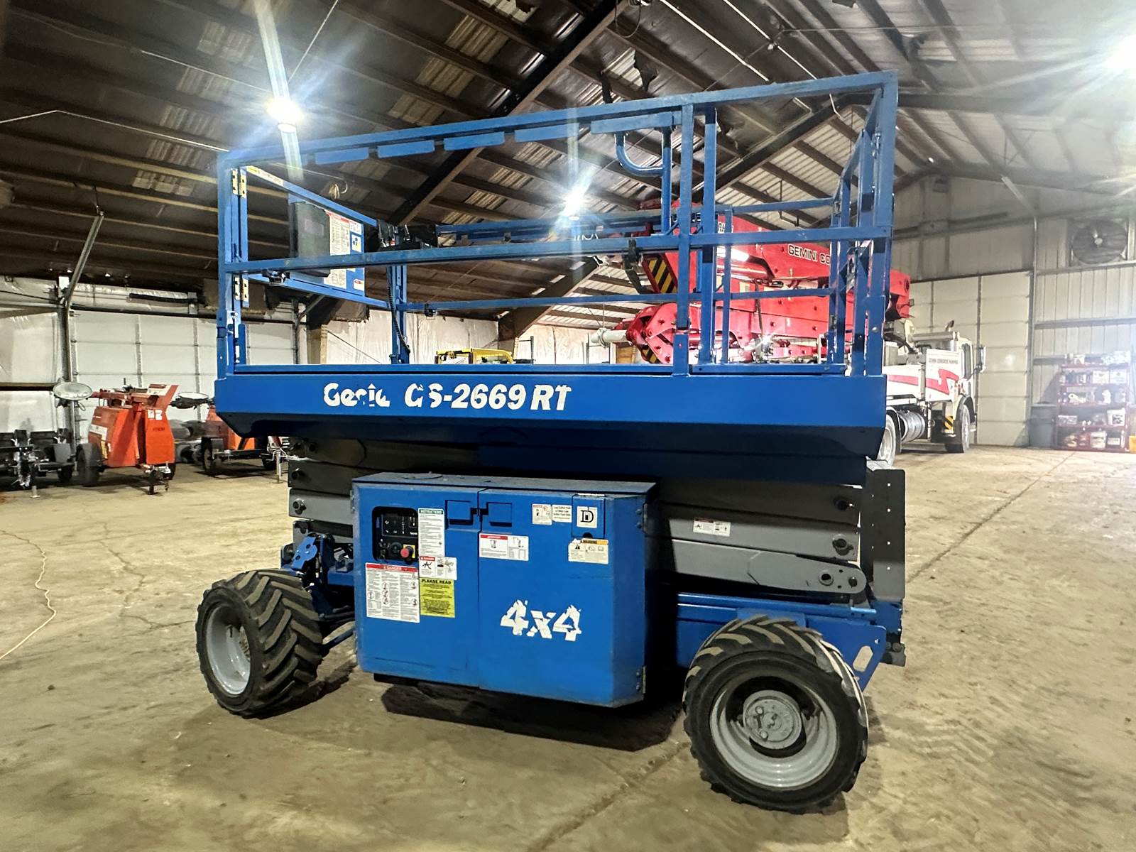 Man Lifts Genie GS 2669 RT 26ft scissor lift rental