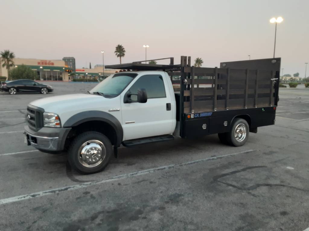 12 ft Stakebed Flatbed Ford F550 Truck with lift gate